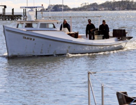 A crab boat pulls into the dock along Gwynn's Island. © A. Devlin/VASG.