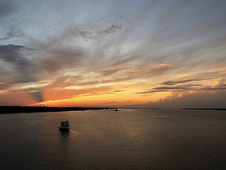 The schooner Alliance turns upriver towards the Yorktown Naval Weapons Station. © Grace Molino.