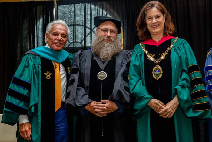 Dr. Eric Hilton (C) with Joe Plumeri (L) and W&M President Katherine Rowe (R) during the Plumeri Awards Ceremony. Photo by Skip Rowland.