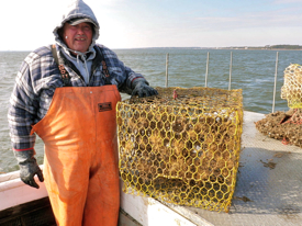 Waterman EC Hogge with a derelict crab pot retrieved from the York River.