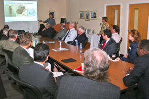 Peng describes his research to SunTrust officials at VIMS.