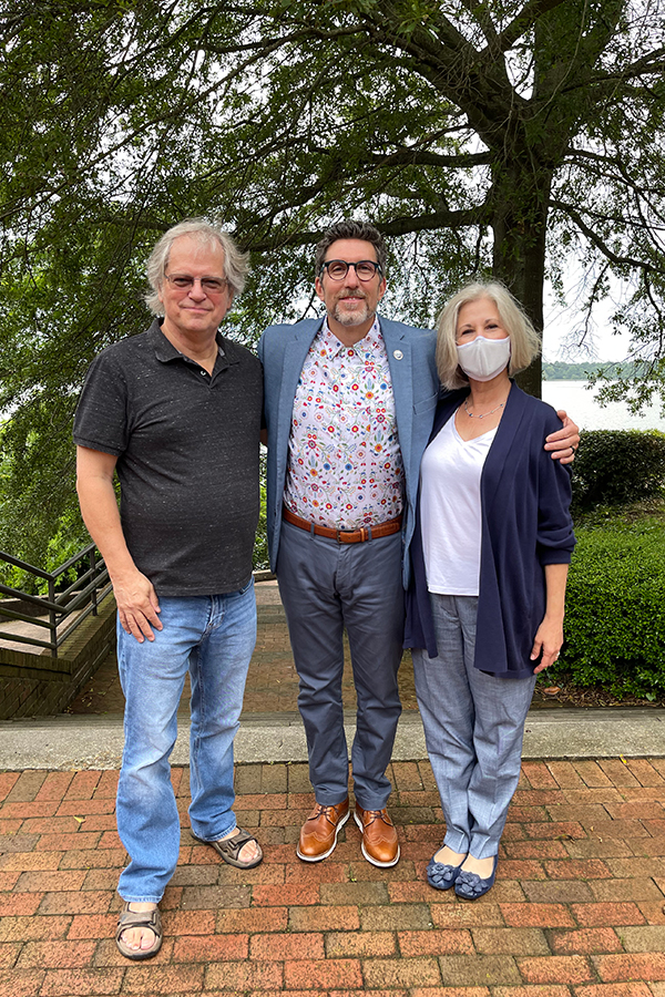 Dr. Mary Fabrizio, winner of the 2021 Excellence in Mentoring Award, with Dr. Roger Mann (L) and Dean & Director Dr. Derek Aday.